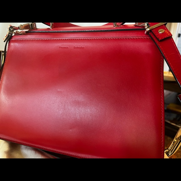Proenza SchoulerDepth:4.75"
Strap 20"
Width:12.5"
Handle Drop:5.25"
Height:9.75” - Picture 10 of 10